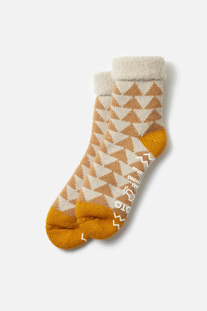 RoToTo Comfy Room Sankaku Socks in Beige Gold feature a chunky knit, geometric triangle pattern, thick cuffs, and white text on the soles. Displayed on a white background.
