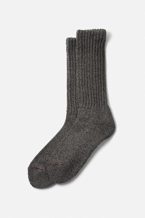 A pair of RoToTo Loose Pile Crew Socks in Mix Charcoal, made in Japan, is laid flat on a white background with one sock overlapping the other.