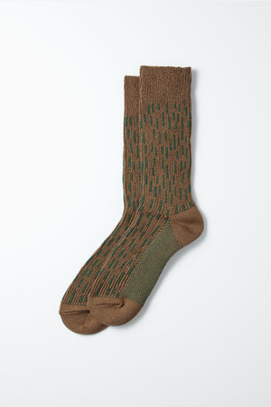 RoToTo Rain Drop Crew Socks in Olive Drab Green feature brown and green raindrop patterns with a ribbed texture. The heel, toe, and cuff are solid brown for a classic Japanese look. From the brand RoToTo.