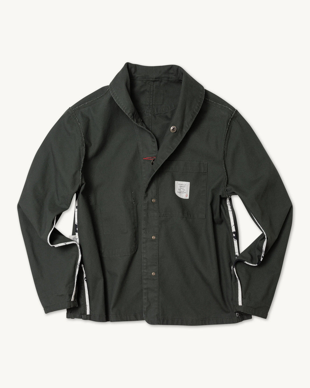 Imperfects Shepherds Shirt Craft Canvas in Greenroom: a dark green organic cotton overshirt with a chest pocket, featuring white graphic-printed panels along the side seams.