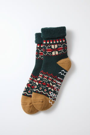 RoToTo Comfy Room Snow Flake Socks in Forest Green by RoToTo feature chunky wool construction, brown toes and heels, dark green cuffs, and a red, cream, and green geometric pattern. Made in Japan; shown on a plain white background.