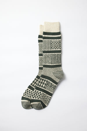 A pair of RoToTo Multi Jacquard Socks in Ivory Gold, featuring geometric patterns, displayed flat on a white background.