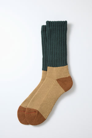 RoToTo Multi Loose Pile Socks by RoToTo feature a color-blocked design with dark green tops, beige middles, and brown heels and toes, shown on a white background.