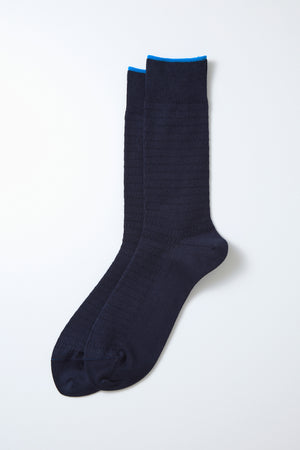 RoToTo Cotton Thermal Socks in navy feature a subtle textured pattern and bright blue cuff detail. Handcrafted in Japan for lasting comfort and style, shown laid flat on a white background. Brand: RoToTo.