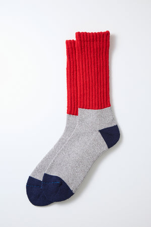 RoToTo Multi Loose Pile Socks by RoToTo, featuring red ribbed uppers, heather gray bodies, and dark blue toe and heel accents, are laid flat on a white background.
